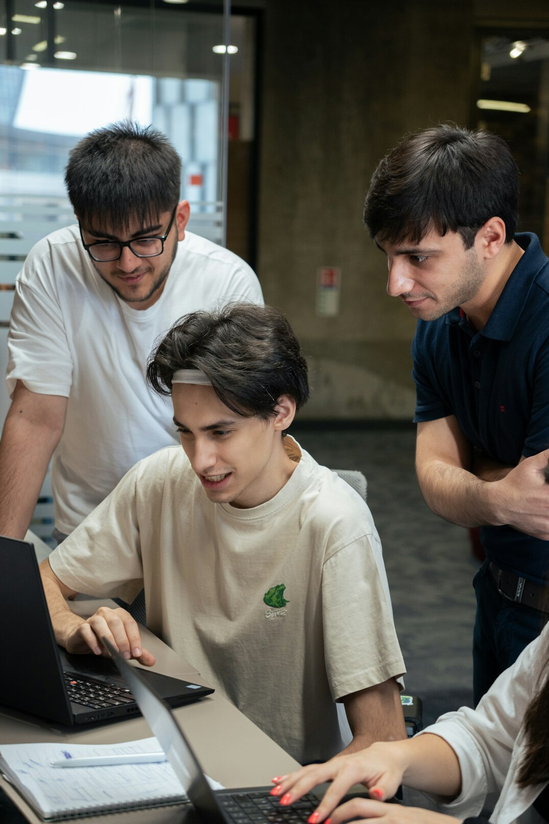 group of students coding together